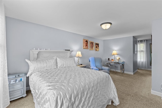 bedroom featuring carpet floors and baseboards