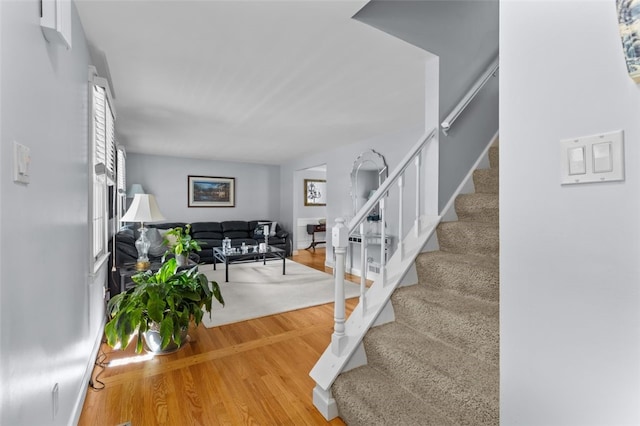 stairs with wood finished floors