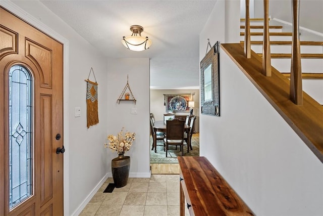 2880 Willowick Ct, South Fayette, PA 15017 - entrance foyer with baseboards, stairway, light tile patterned flooring, and a textured ceiling