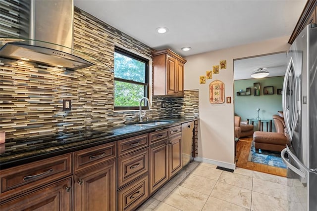 2880 Willowick Ct, South Fayette, PA 15017 - kitchen with stainless steel appliances, wall chimney range hood, a sink, tasteful backsplash, and light tile patterned floors