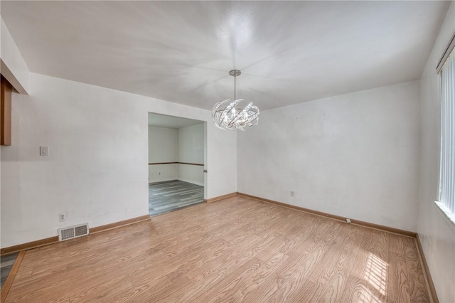 433 Brunner Dr, Monroeville, PA 15146 - unfurnished dining area with a chandelier, light wood finished floors, and baseboards