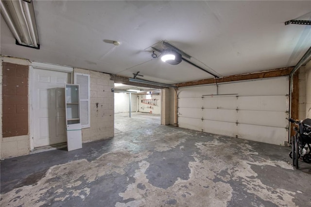 433 Brunner Dr, Monroeville, PA 15146 - garage featuring concrete block wall and a garage door opener