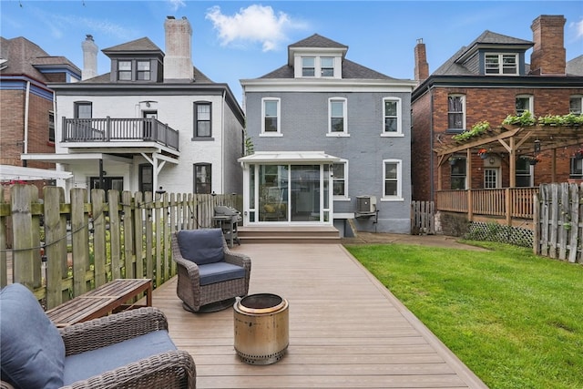 608 N Euclid Ave, East Liberty, PA 15206 - back of house with a chimney, a deck, and a sunroom