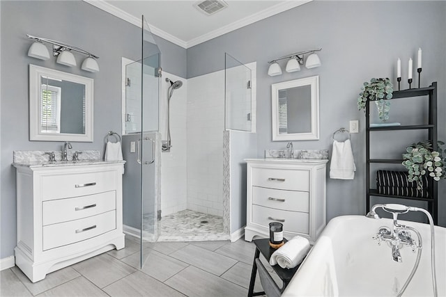 608 N Euclid Ave, East Liberty, PA 15206 - bathroom with a stall shower, baseboards, a freestanding tub, two vanities, and ornamental molding