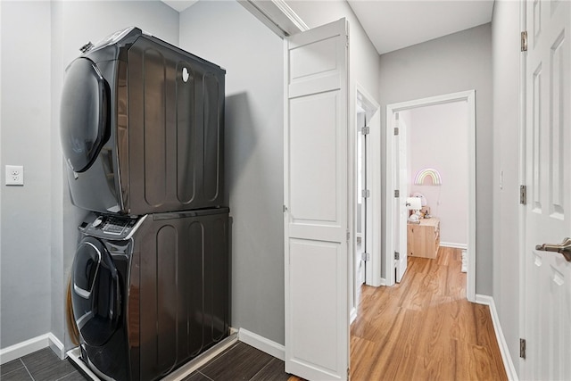 608 N Euclid Ave, East Liberty, PA 15206 - laundry room featuring estacked washer and dryer, baseboards, and wood finished floors
