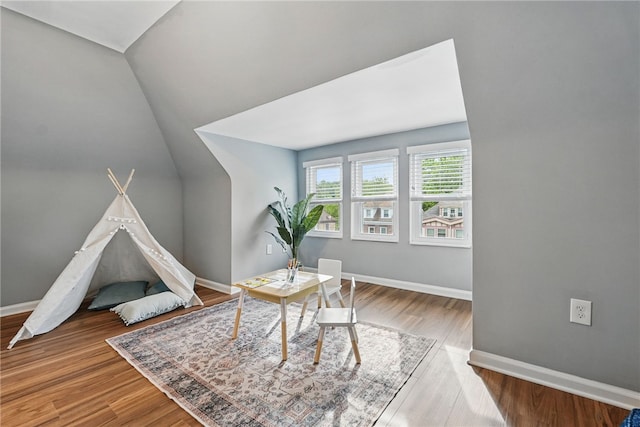 608 N Euclid Ave, East Liberty, PA 15206 - recreation room with baseboards, wood finished floors, and vaulted ceiling