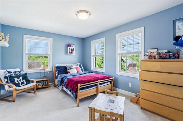 bedroom featuring carpet flooring and baseboards