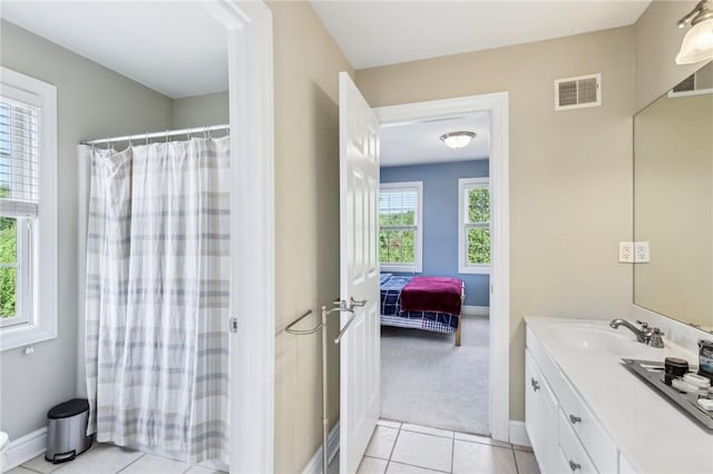 full bathroom with vanity, tile patterned flooring, baseboards, and a shower with curtain