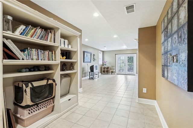 corridor with tile patterned flooring, baseboards, and recessed lighting