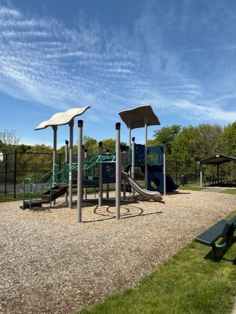 communal playground featuring fence