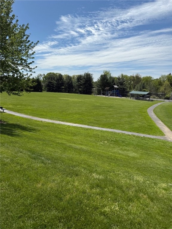 surrounding community with a yard