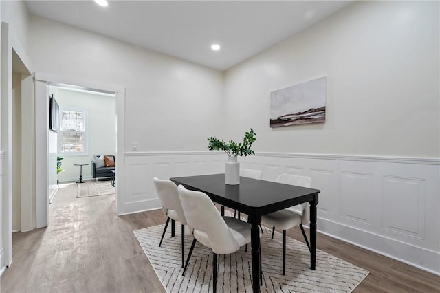 3423 Denny St, Lawrenceville, PA 15201 - dining room with wood finished floors, wainscoting, recessed lighting, and a decorative wall