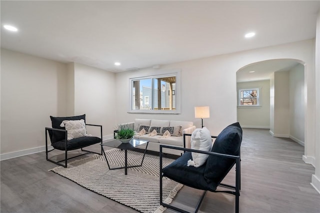 3423 Denny St, Lawrenceville, PA 15201 - living room featuring arched walkways, baseboards, wood finished floors, and recessed lighting