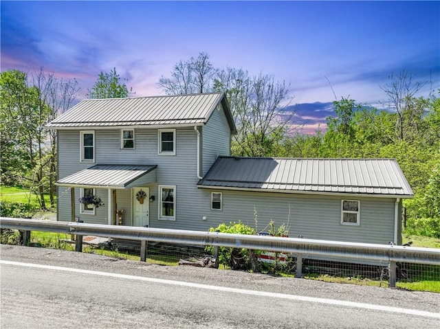 view of front of property featuring metal roof and a standing seam roof