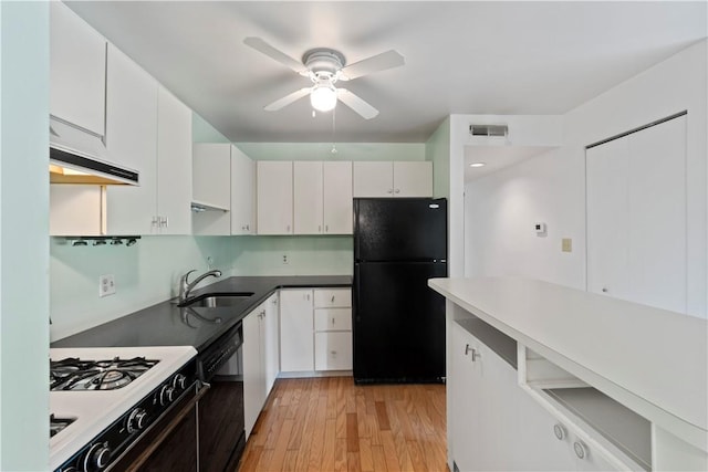 2409 Kenzie Dr, Robinson Twp Nwa, PA 15205 - kitchen featuring black appliances, a sink, under cabinet range hood, ceiling fan, and white cabinetry