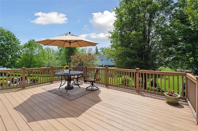 wooden terrace with outdoor dining area