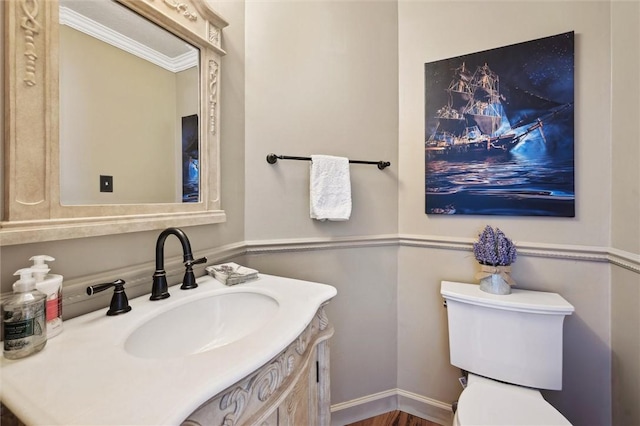 half bathroom with toilet and vanity