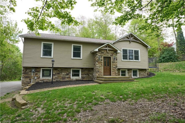 605 E Portersville Rd, Muddy Creek Twp, PA 16051 - raised ranch featuring a trampoline, stone siding, and a front yard