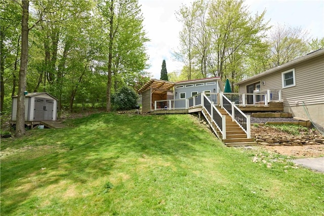 605 E Portersville Rd, Muddy Creek Twp, PA 16051 - view of grassy yard with a shed, a wooden deck, an outdoor structure, and stairs