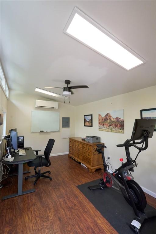 605 E Portersville Rd, Muddy Creek Twp, PA 16051 - home office featuring a wall mounted air conditioner, wood finished floors, baseboards, and a ceiling fan