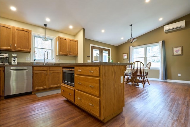 605 E Portersville Rd, Muddy Creek Twp, PA 16051 - kitchen with stainless steel appliances, a sink, a wall mounted AC, a peninsula, and healthy amount of natural light