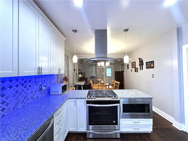 kitchen featuring stainless steel appliances, a peninsula, island range hood, white cabinets, and dark wood-style flooring
