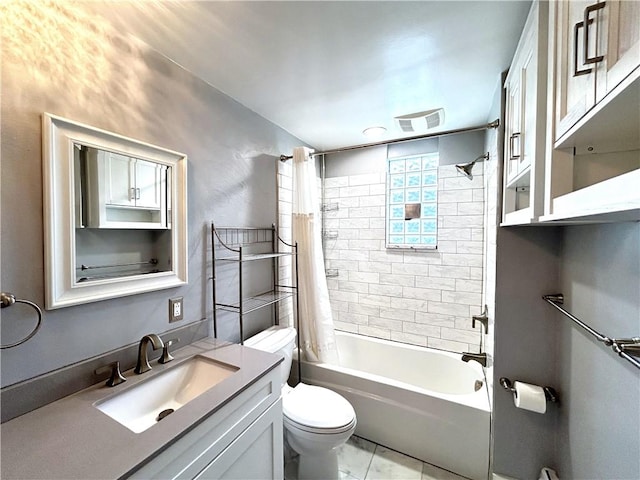 bathroom featuring toilet, shower / tub combo with curtain, and vanity