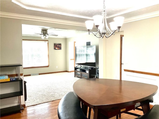 112 Pheasant Ridge Dr, Center Twp But, PA 16001 - dining space featuring crown molding, a chandelier, a raised ceiling, wood finished floors, and baseboards