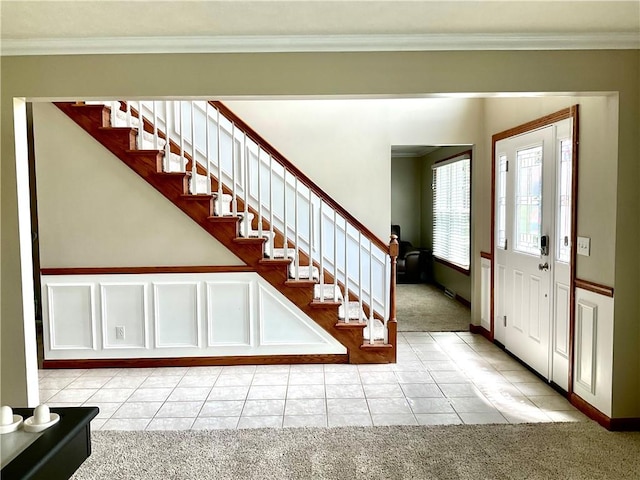 112 Pheasant Ridge Dr, Center Twp But, PA 16001 - foyer entrance with light colored carpet, ornamental molding, stairway, light tile patterned floors, and baseboards