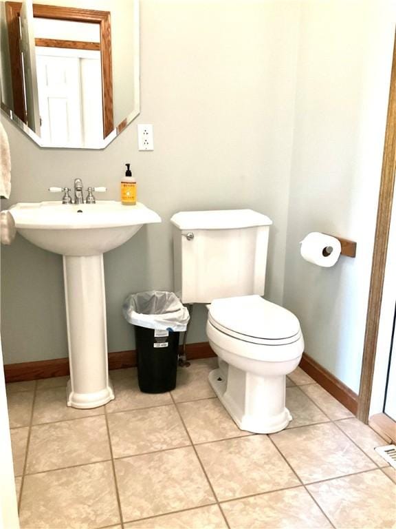 112 Pheasant Ridge Dr, Center Twp But, PA 16001 - bathroom with baseboards, toilet, and tile patterned flooring