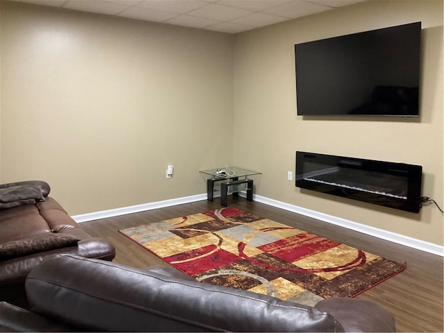 112 Pheasant Ridge Dr, Center Twp But, PA 16001 - living area with wood finished floors, baseboards, a drop ceiling, and a glass covered fireplace