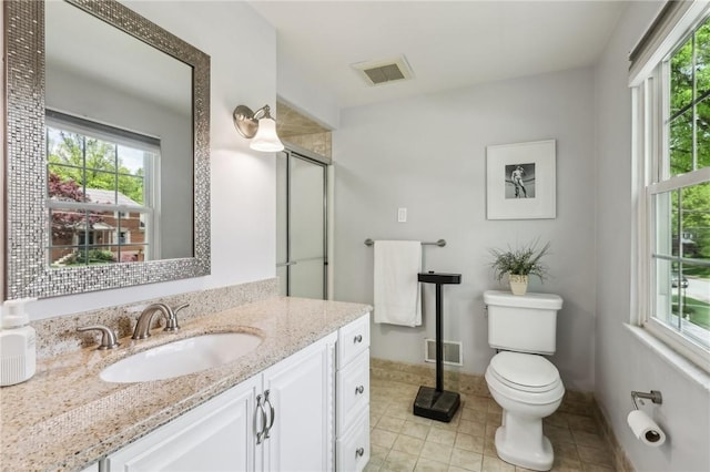 bathroom with tile patterned flooring, healthy amount of natural light, and vanity