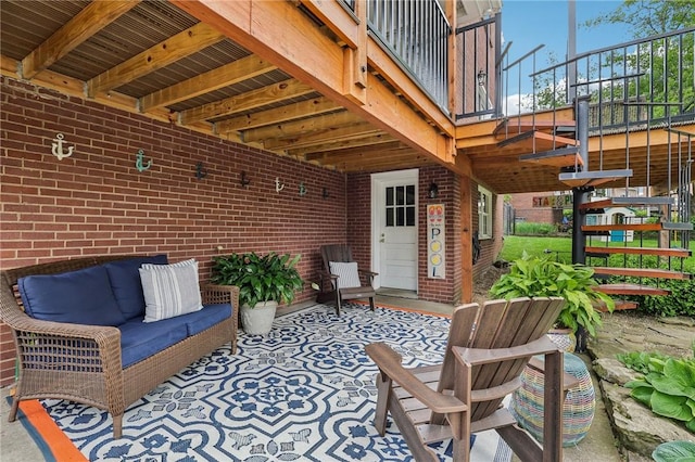 view of patio / terrace with stairs and outdoor lounge area