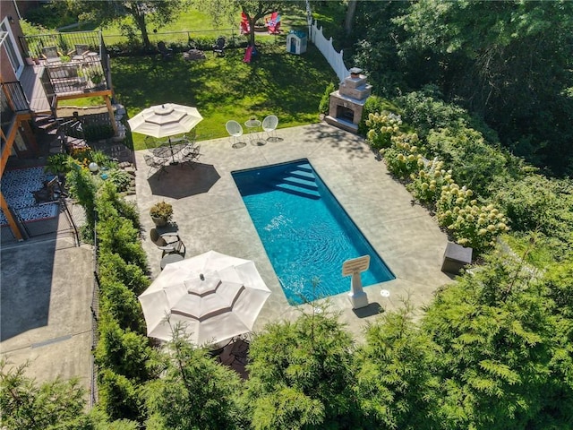 view of pool featuring a patio and fence