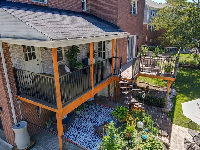wooden deck featuring outdoor dining area and a patio area