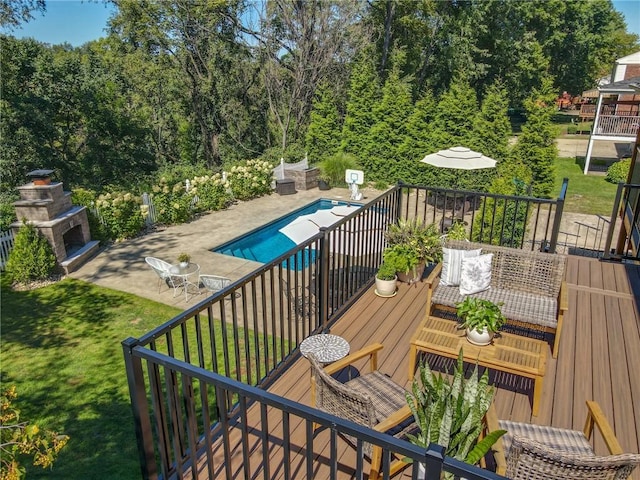 balcony with a patio area, outdoor dining area, and view of pool
