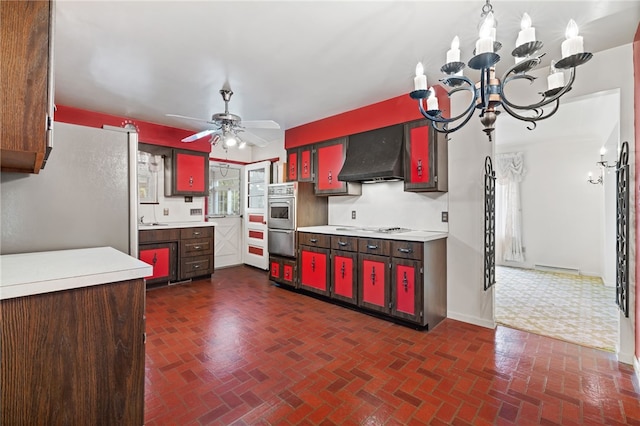 kitchen with exhaust hood, brick patterned floors, light countertops, and stainless steel appliances