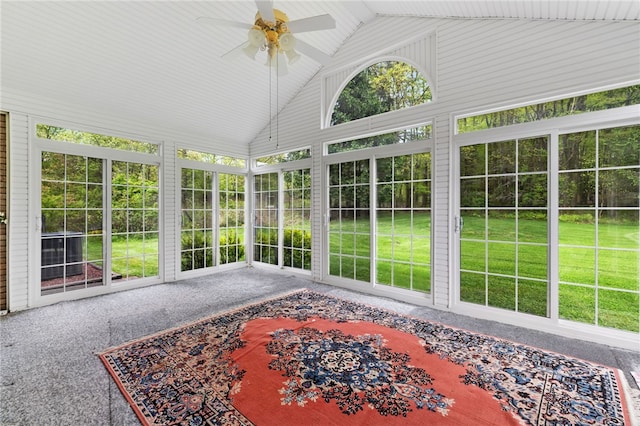 sunroom / solarium with vaulted ceiling and a ceiling fan