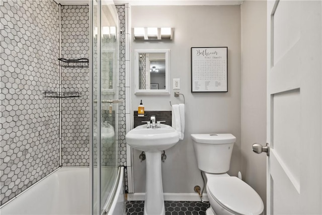 1009 Connor Rd, Castle Shannon, PA 15234 - full bath with toilet, shower / bath combination with glass door, and baseboards
