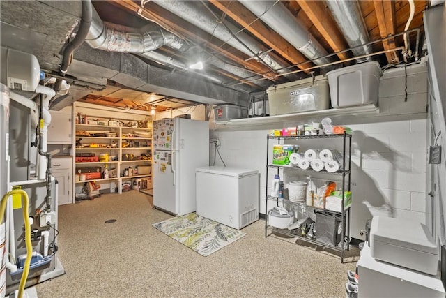 1009 Connor Rd, Castle Shannon, PA 15234 - unfinished below grade area featuring freestanding refrigerator, refrigerator, heating unit, and concrete block wall