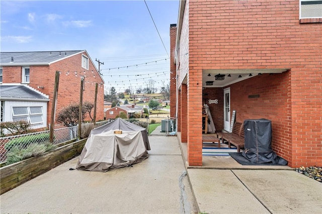 1009 Connor Rd, Castle Shannon, PA 15234 - view of patio featuring fence and central AC