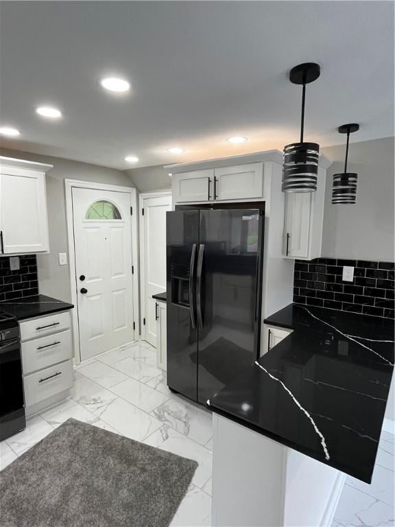 kitchen with black appliances, dark countertops, recessed lighting, a peninsula, and white cabinetry
