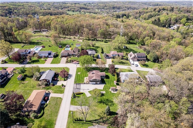 aerial view of residential area with a heavily wooded area