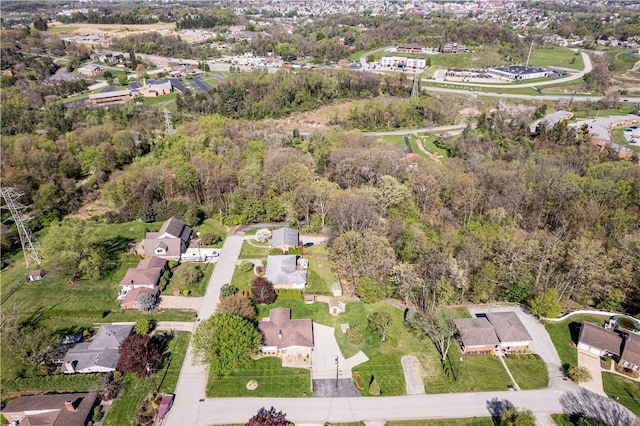 aerial view of property and surrounding area with nearby suburban area