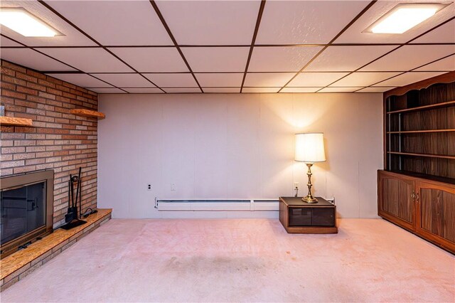 626 Woodburn Ln, Hempfield Twp Wml, PA 15601 - unfurnished room with carpet, baseboard heating, a fireplace, and a drop ceiling