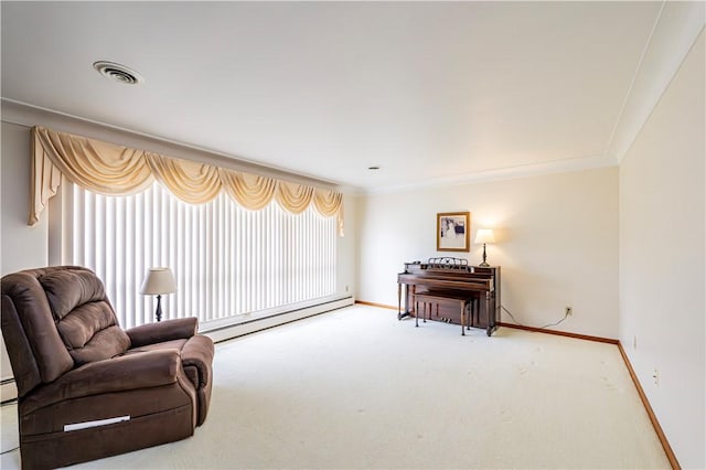 living area with a baseboard heating unit, carpet flooring, baseboards, and ornamental molding