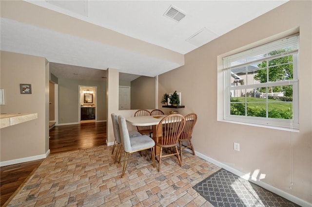 430 Southfield Dr, Hempfield Twp Wml, PA 15601 - dining space featuring baseboards, stone tile flooring, and healthy amount of natural light