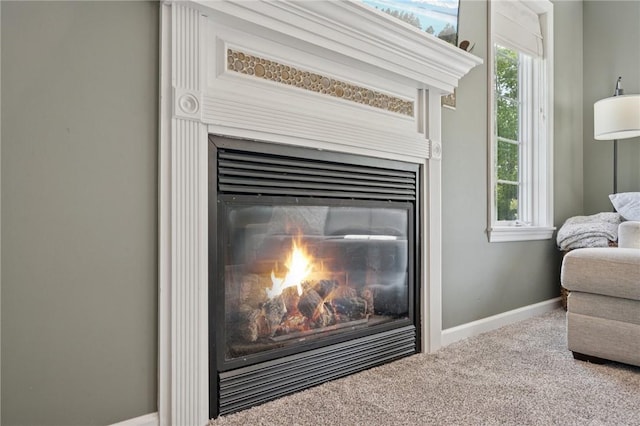 430 Southfield Dr, Hempfield Twp Wml, PA 15601 - detailed view of carpet floors, a glass covered fireplace, and baseboards