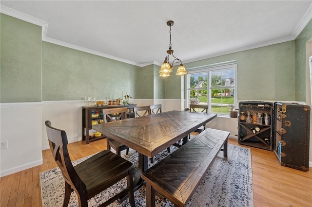 430 Southfield Dr, Hempfield Twp Wml, PA 15601 - dining room with light wood-style floors, crown molding, a chandelier, and baseboards