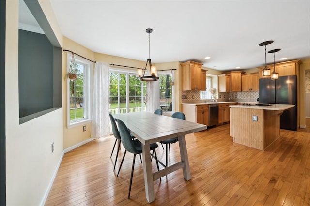 430 Southfield Dr, Hempfield Twp Wml, PA 15601 - dining area with baseboards, light wood-style floors, a chandelier, and recessed lighting